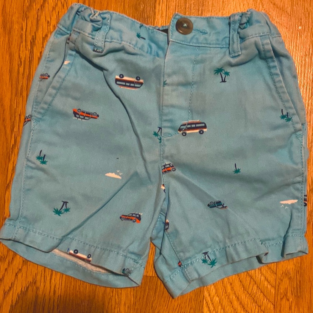 light blue, cars and and palm trees and Black basketball shorts with red lines